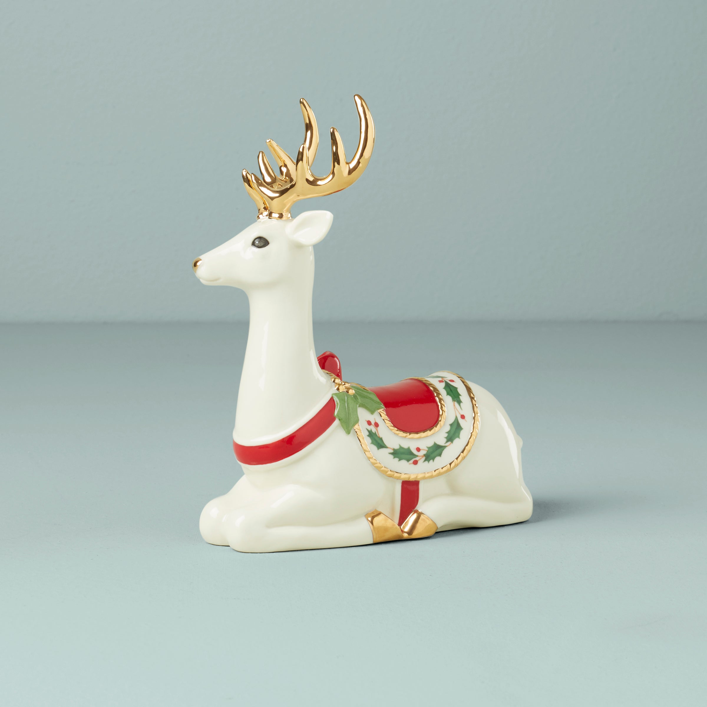 Festive Sitting Reindeer Figurine with Holly Saddle | Holiday Decor