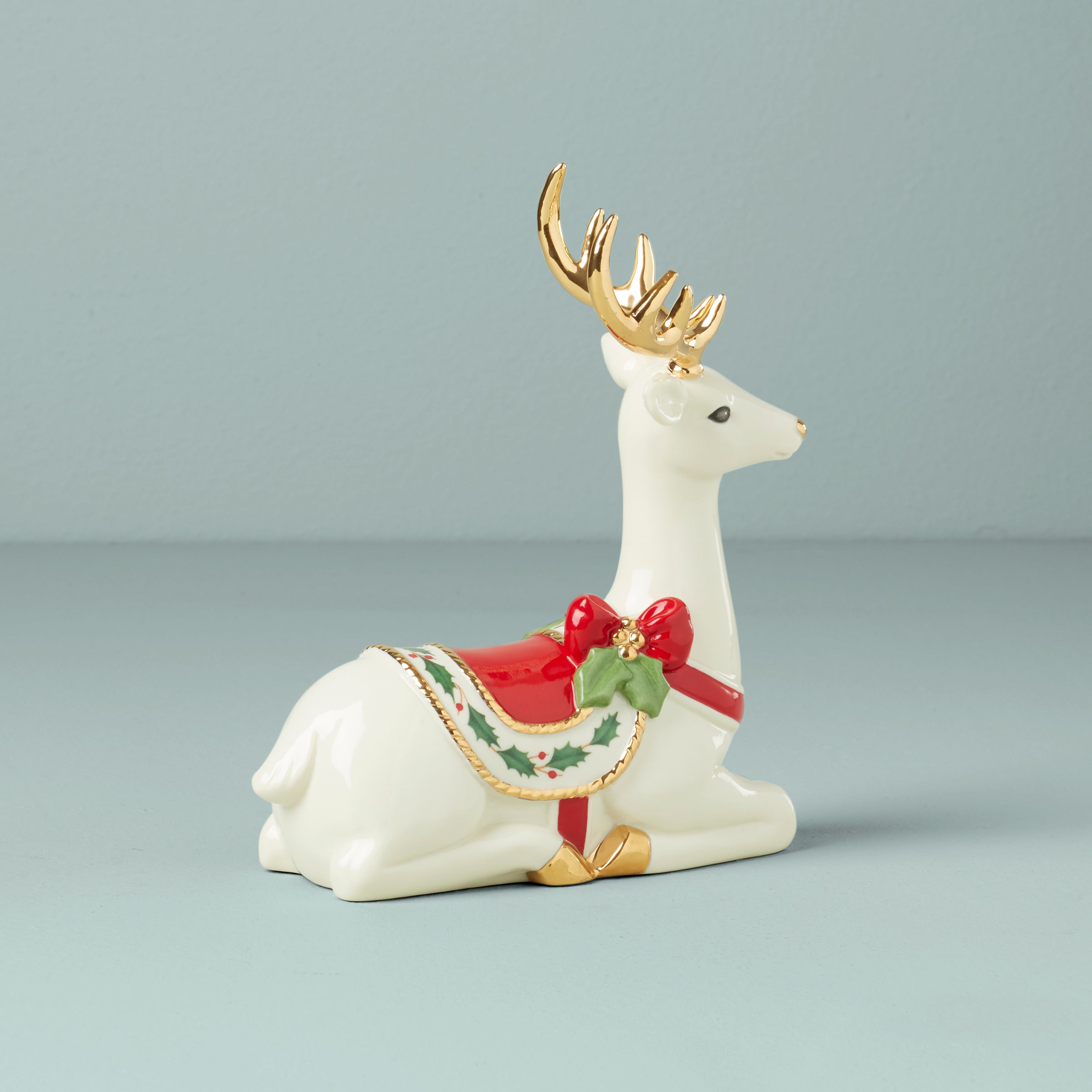 Festive Sitting Reindeer Figurine with Holly Saddle | Holiday Decor