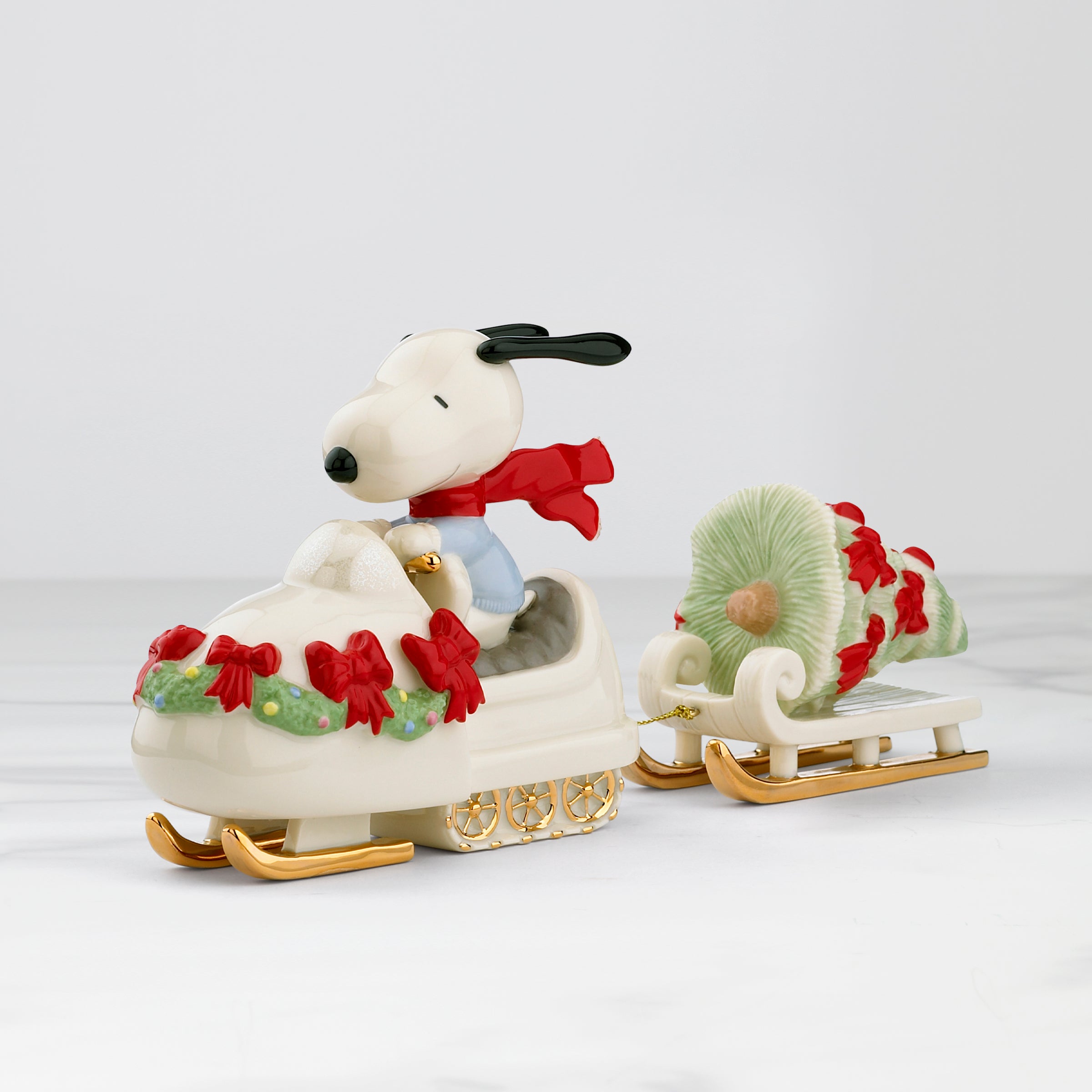 Christmas Snoopy Snowmobile Figurine with Tree | PEANUTS®